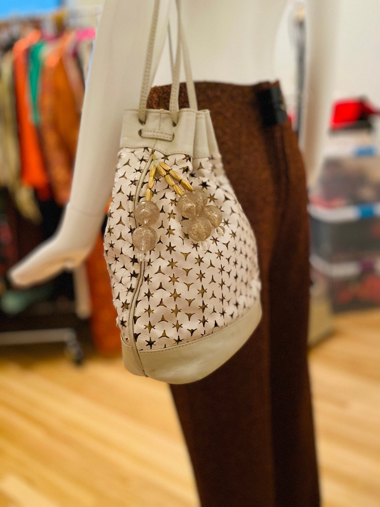 Neiman Marcus 80s Italian Metallic Gold and Pearl Leather Disco Star Perforated Tassels Drawstring Bucket Bag