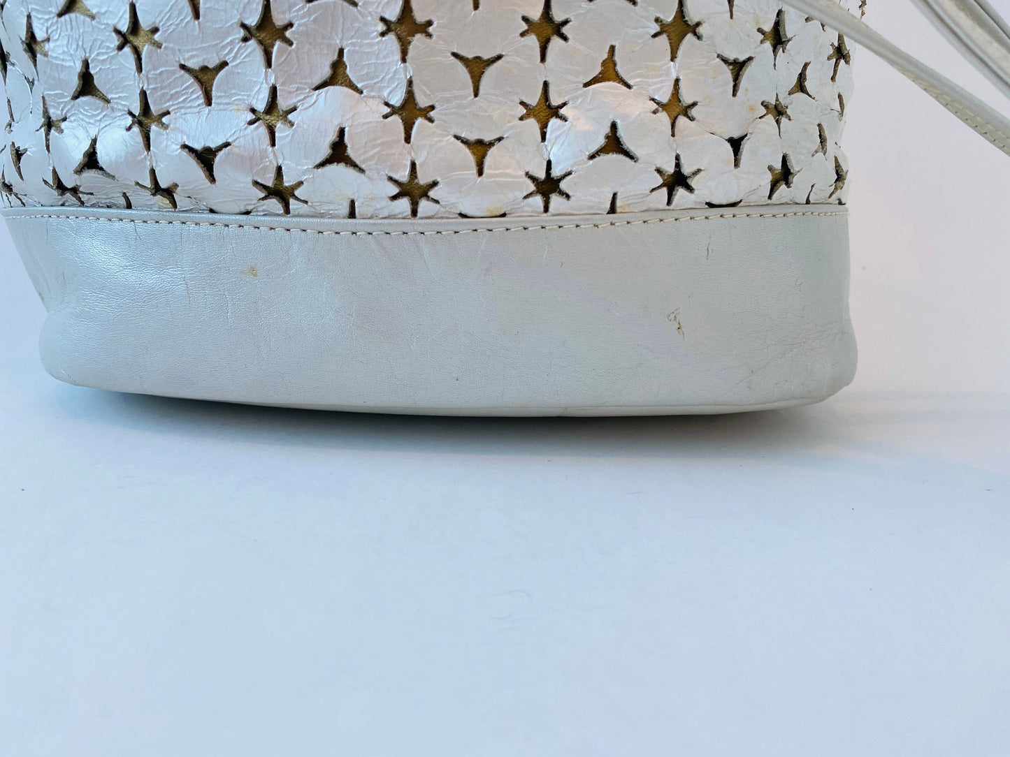 Neiman Marcus 80s Italian Metallic Gold and Pearl Leather Disco Star Perforated Tassels Drawstring Bucket Bag