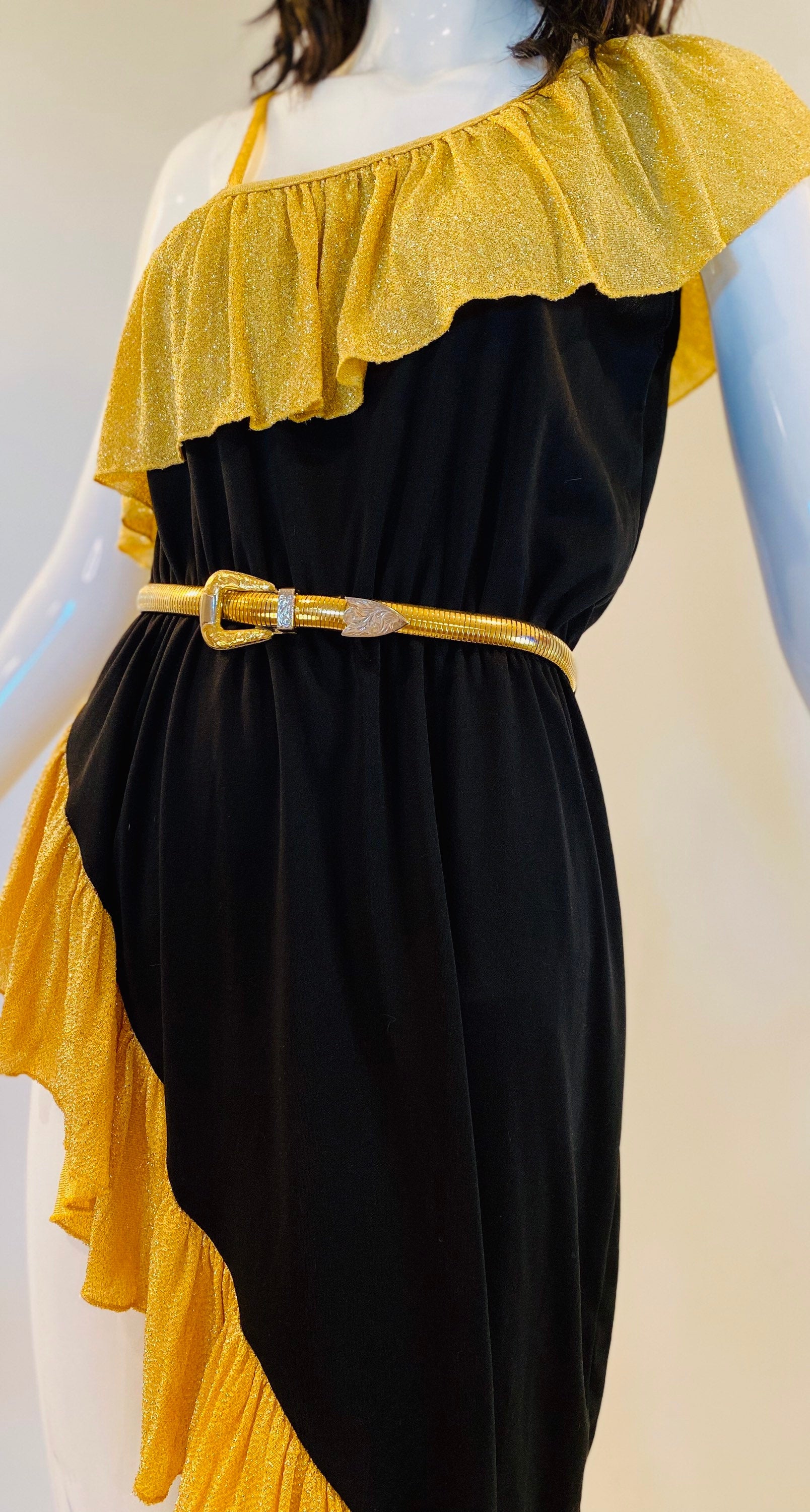 Vintage signed Accessocraft NYC gold stretchy snake chain western metal buckle belt.